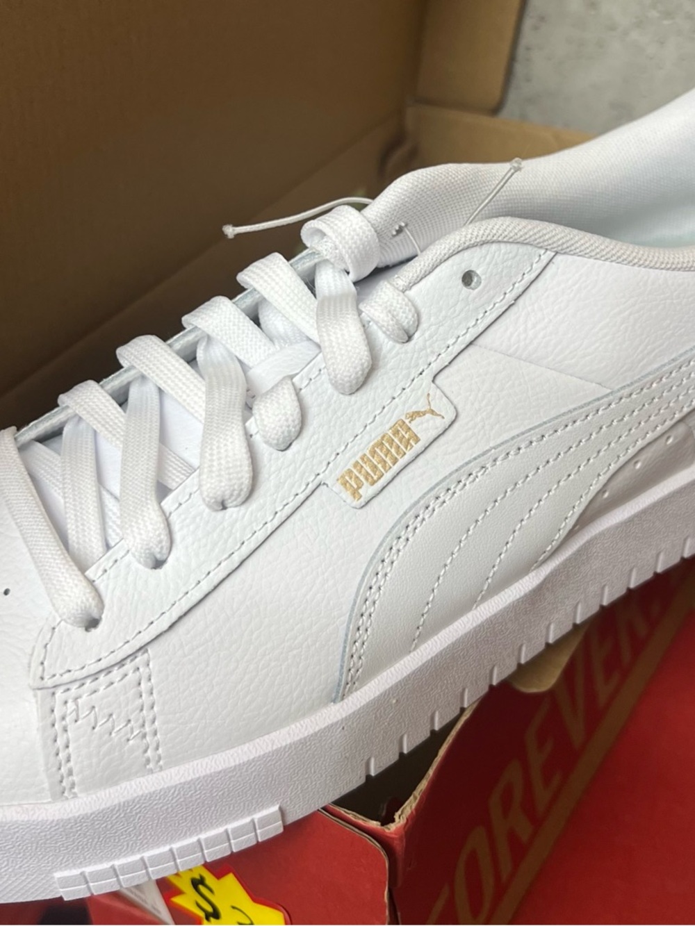 Puma White Low-Top Leather Sneaker with Gold Accent